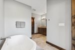 The stunning master bathroom has separate soaking tub and shower